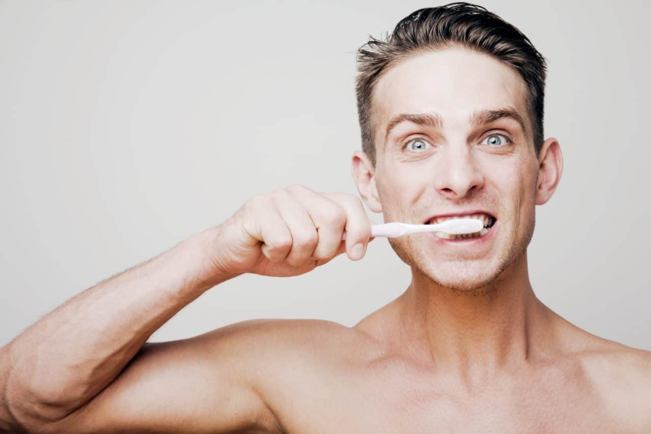 Dental Mistakes - Man Brushing His Teeth