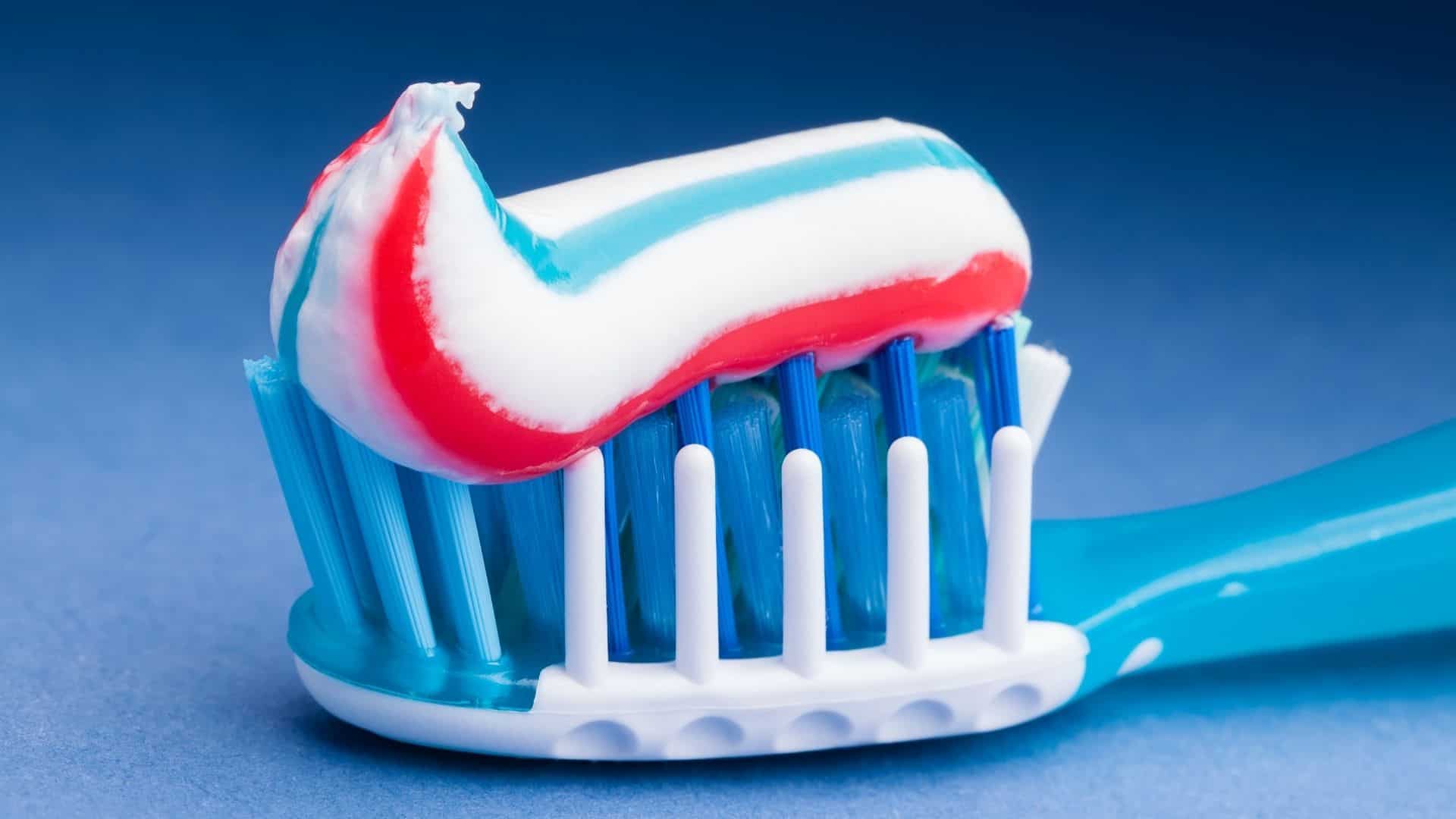 bright colored toothpaste on head of toothbrush