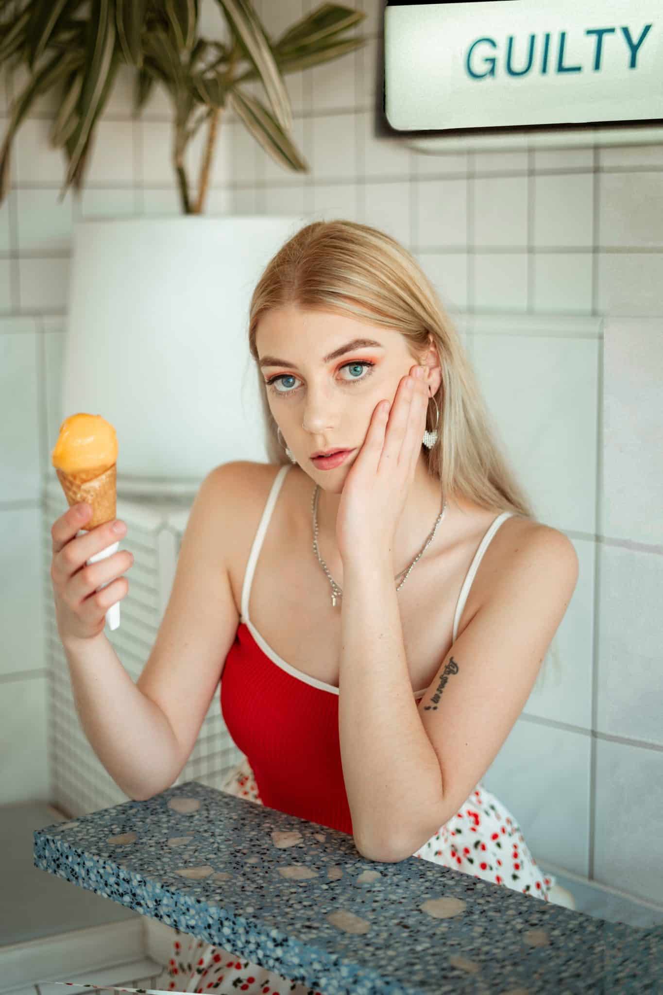 woman ice cream sore face