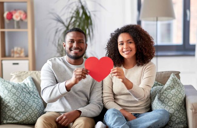 A happy couple smiles for Valentine's Day.